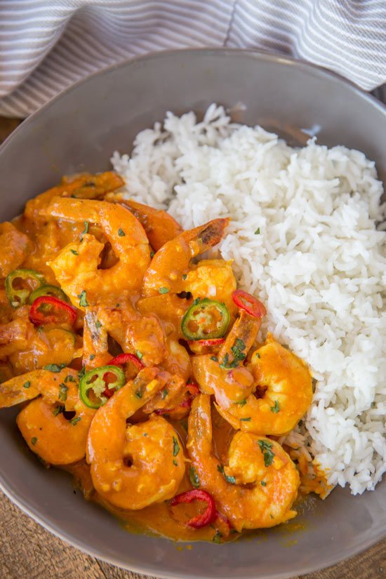 Indian Shrimp Curry made with coconut milk, tomato sauce and warm Indian spices is a quick 20 minute curry dish you can enjoy any day of the week! Indian Shrimp Curry Recipe | Skinnytaste
