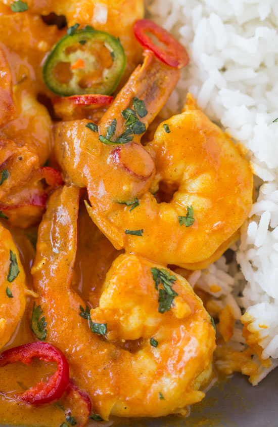 Indian Shrimp Curry made with coconut milk, tomato sauce and warm Indian spices is a quick 20 minute curry dish you can enjoy any day of the week! Indian Shrimp Curry Recipe | Skinnytaste
