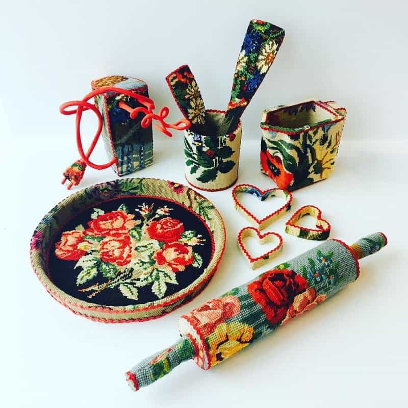 Dressed up vintage household things in cross stich embroiderys return to life as beautiful art objects