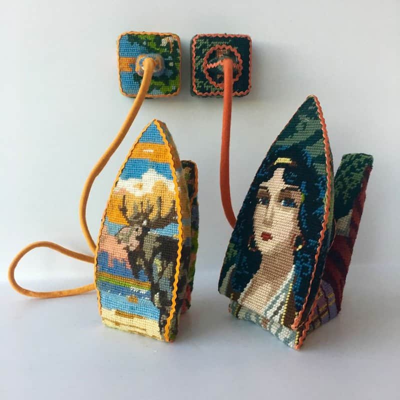 Dressed up vintage household things in cross stich embroiderys return to life as beautiful art objects