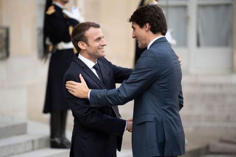 I Can’t Stop Staring at This Photo of Trump Walking Macron Like a Puppy / Elle.com